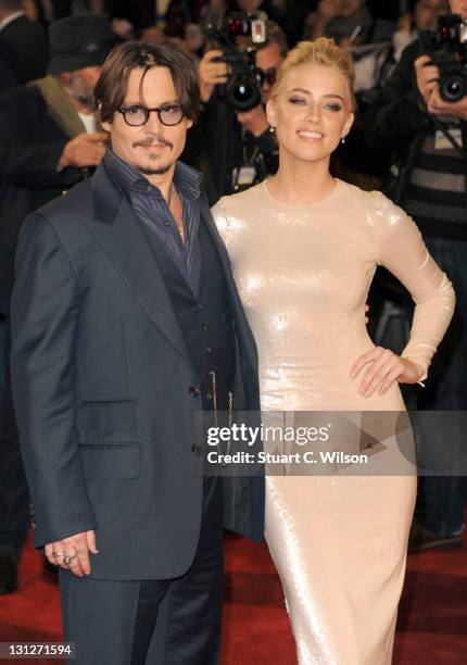 Johnny Depp and Amber Heard attend The UK Premiere of 'The Rum Diary' at on November 3, 2011 in London, England.