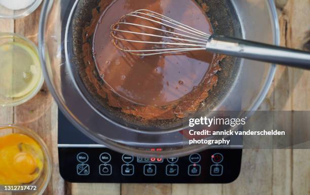 chocolate au bain marie - chocolate melting stock pictures, royalty-free photos & images