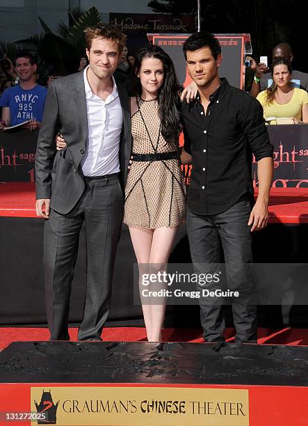 Actor Robert Pattinson, actress Kristen Stewart and actor Taylor Lautner at "The Twilight Trio" Hand/Foorprint Ceremony at Grauman's Chinese Theatre...