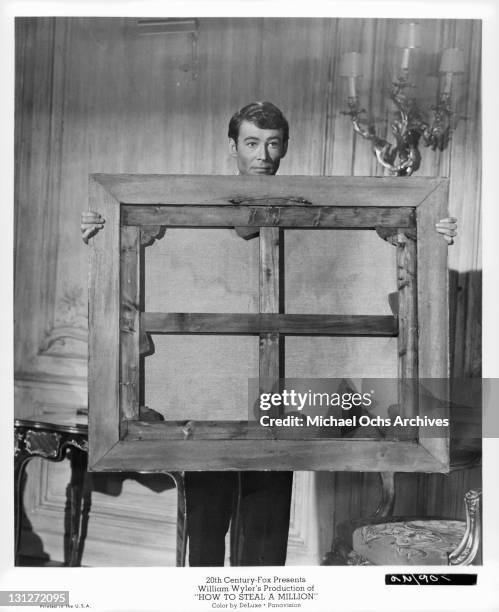 Peter O'Toole is caught red-handed stealing a painting in a scene from the film 'How To Steal A Million', 1966.