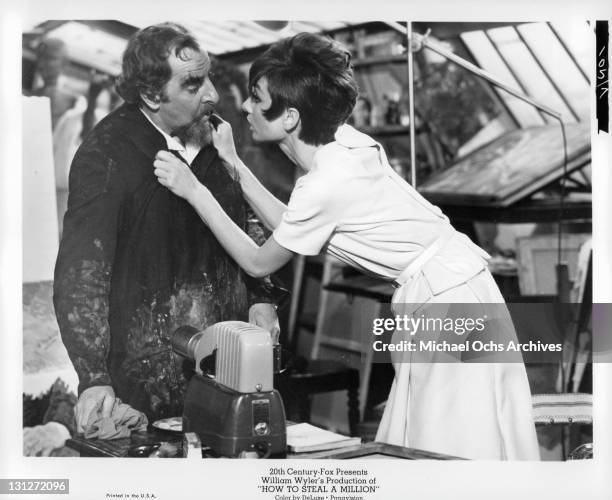 Hugh Griffith is begged Audrey Hepburn to give up his career as a successful forger in a scene from the film 'How To Steal A Million', 1966.