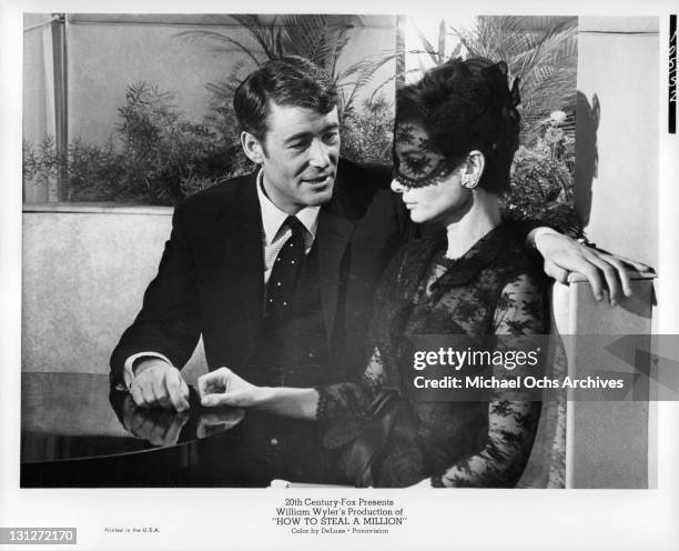 Peter O'Toole and Audrey Hepburn in Paris' Ritz Bar to discuss a million dollar heist in a scene from the film 'How To Steal A Million', 1966.