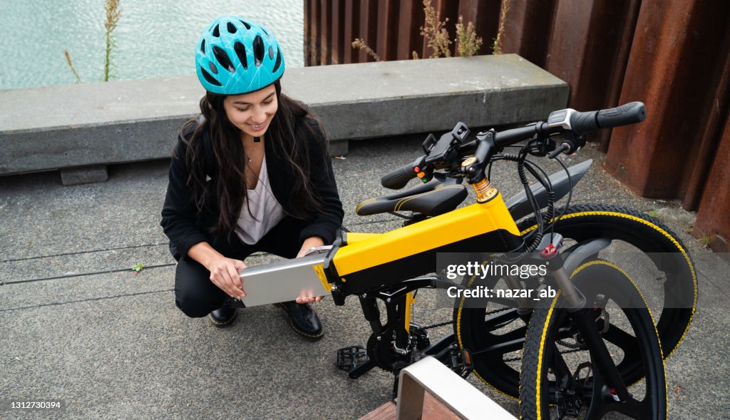 Changing the battery pack for electric bicycle.
