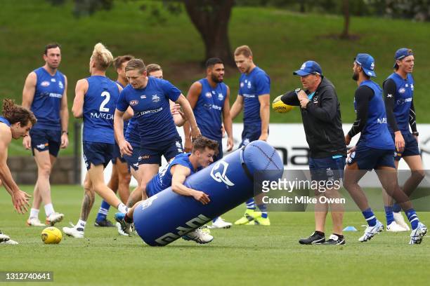 Kayne Turner of the Kangaroos performs a training drill during a North Melbourne Kangaroos AFL training session at Arden Street Ground on April 16,...