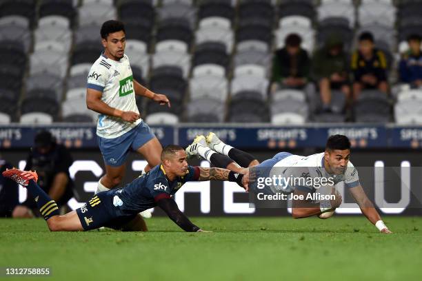 Rieko Ioane of the Blues scores a try during the round eight Super Rugby Aotearoa match between the Highlanders and the Blues at Forsyth Barr...