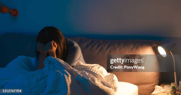 woman feel depress in bedroom - can't sleep stock pictures, royalty-free photos & images