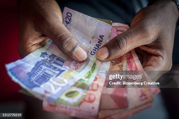 ghanaian cedi banknotes - africa economy stock pictures, royalty-free photos & images