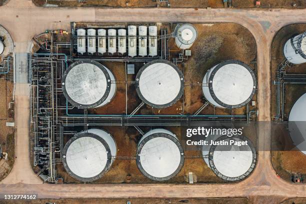 drone view of an oil refinery - oil refinery stock pictures, royalty-free photos & images