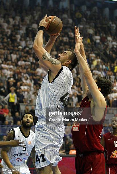 Nikola Pekovic of Partizan MTS Belgrade shoots for the basket during the 2011-2012 Turkish Airlines Euroleague Regular Season Game Day 3 between...