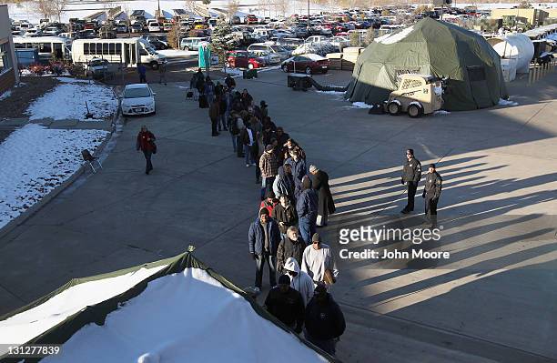 Homeless U.S. Military veterans stand in line to receive free services at a "Stand Down" event hosted by the Department of Veterans Affairs on...
