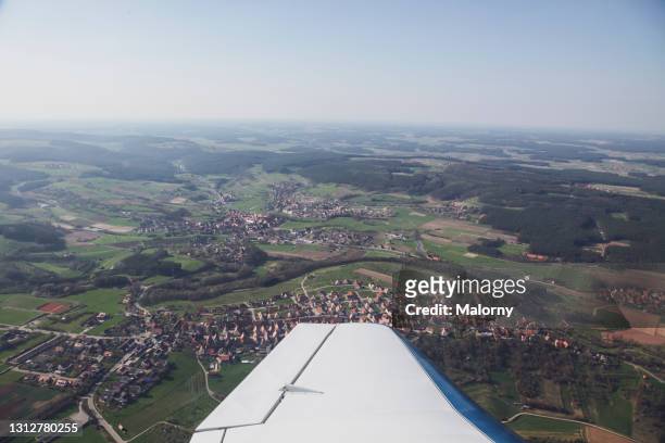 view of the landscape from an airplane. germany, bavaria, franconia - nuremberg stock-fotos und bilder