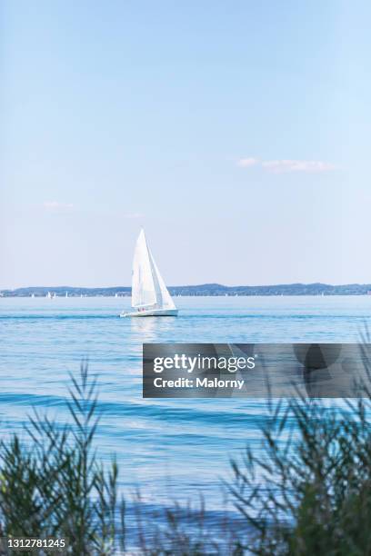 panoramic view of lake chiemsee. boats sailing. - bavaria summer stock pictures, royalty-free photos & images