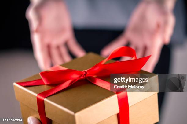 personal perspective of one person receiving a gift from a friend. - recived stock pictures, royalty-free photos & images