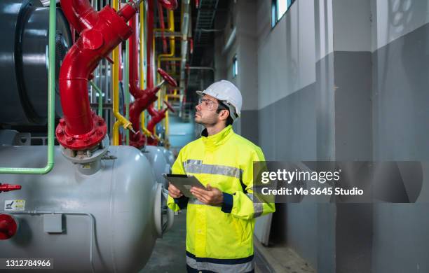 industrial engineer cooling tower in building system work machine. condenser water supply pipe lines. ventilation.  large industrial building to control air system. - air duct repair stock pictures, royalty-free photos & images