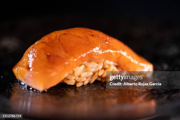 salmon and rice nigiri with soy sauce glaze - nigiri stockfoto's en -beelden