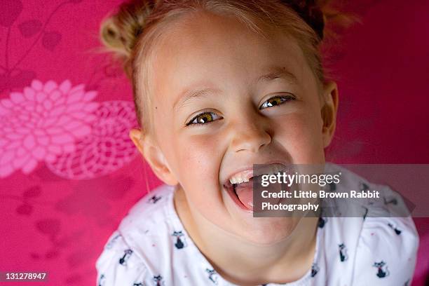 hannah with missing teeth - blonde girl sticking out her tongue stock pictures, royalty-free photos & images