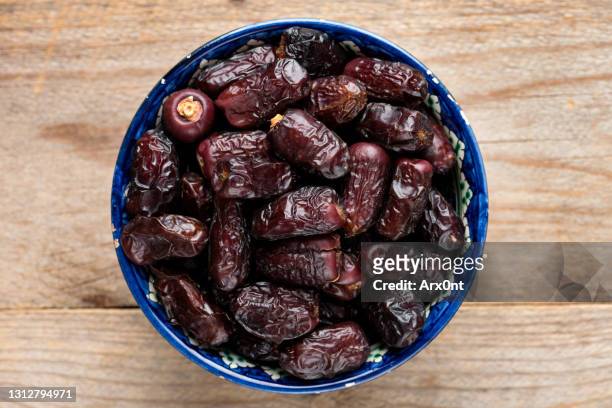dry dates in a bowl top view - ramadan dates stock pictures, royalty-free photos & images