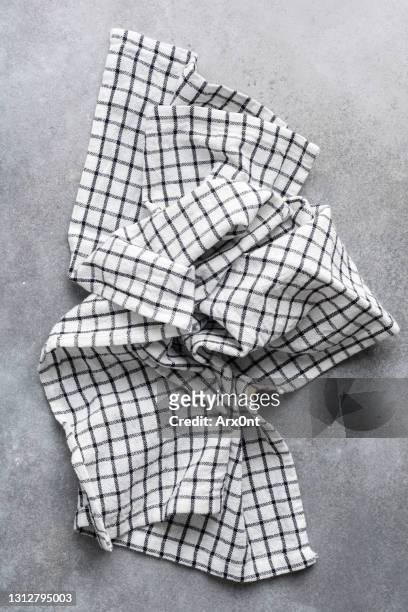 casual white checkered kitchen towel on grey concrete - dish towel stock pictures, royalty-free photos & images