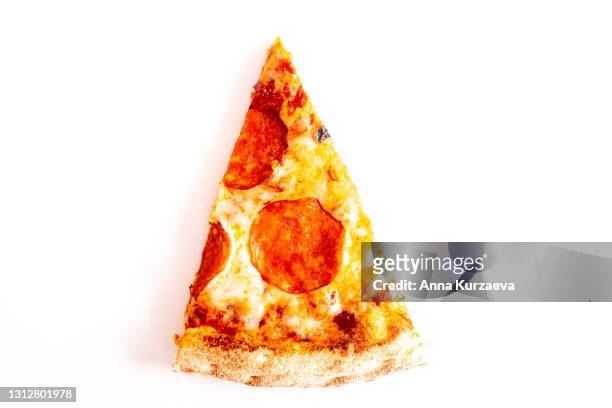 piece of pizza pepperoni isolated on white background - pepperoni pizza overhead stock pictures, royalty-free photos & images