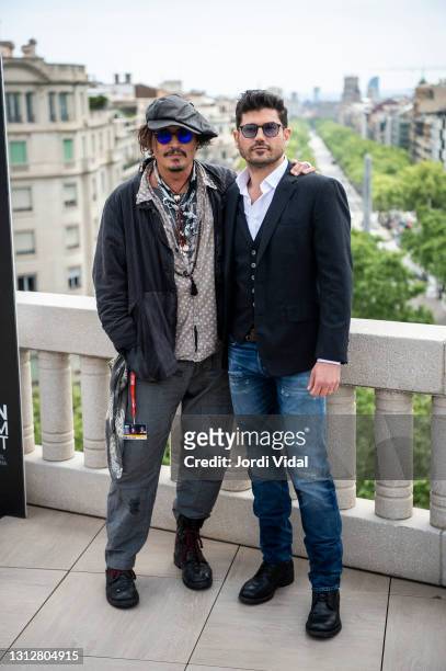 American actor Johnny Depp and film director Andrew Levitas attend a photocall to present his latest movie "Minamata" during BCN Film Festival at...