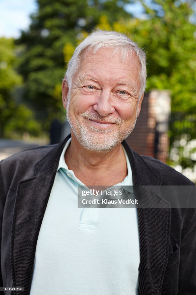 Portrait of mature man smiling to camera