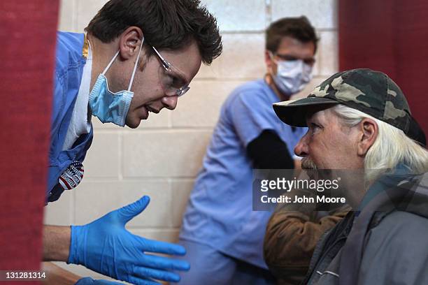 Homeless U.S. Army veteran and unemployed carpenter Steven Wise , receives a dental checkup at a "Stand Down" event hosted by the Department of...