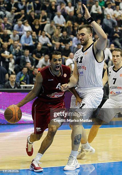 Chris Hill, #4 of Belgacom Spirou Basket in action against Nikola Pekovic of Partizan MTS Belgrade during the 2011-2012 Turkish Airlines Euroleague...