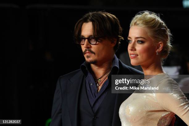 Johnny Depp and Amber Heard attend The UK Premiere of 'The Rum Diary' at at Odean, Kensington on November 3, 2011 in London, England.