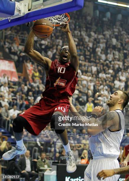 Andre Riddick, #10 of Belgacom Spirou Basket goes up tp the basket, watched by Nikola Pekovic of Partizan MTS Belgrade during the 2011-2012 Turkish...