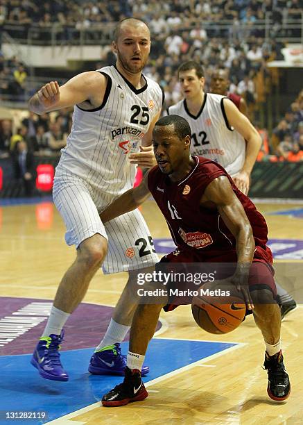 Demond Mallet, #12 of Belgacom Spirou Basket in action against Milan Macvan of Partizan MTS Belgrade during the 2011-2012 Turkish Airlines Euroleague...