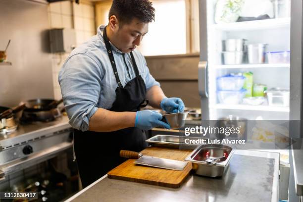 vietnamese chef cooking beef in restaurant kitchen - commercial kitchen and ingredients stock pictures, royalty-free photos & images