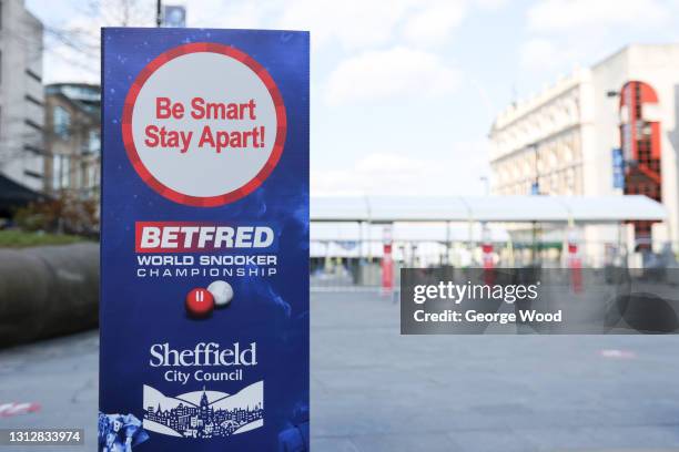 General view of a 'Be Smart, Stay Apart' sign promoting social distancing outside the Crucible Theatre prior to the Betfred World Snooker...