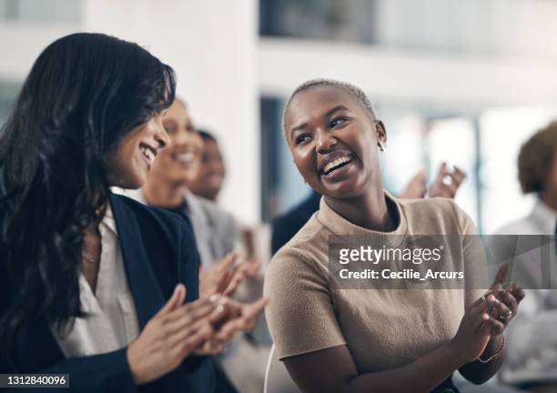 shot of businesspeople clapping hands while attending a business presentation - clapping stock pictures, royalty-free photos & images