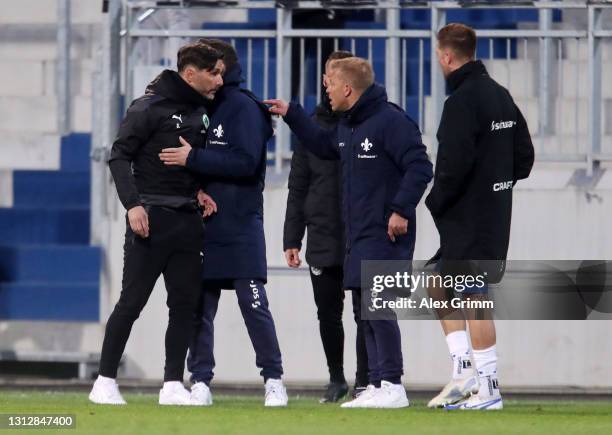 Stefan Leitl, Head Coach of SpVgg Greuther Furth clashes with Markus Anfang, Head Coach of SV Darmstadt 98 after the Second Bundesliga match between...