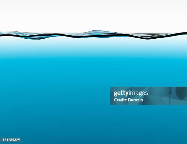 side view of a tank of water - wateroppervlak stockfoto's en -beelden
