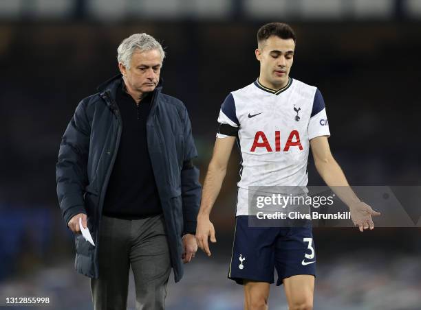 Jose Mourinho, Manager of Tottenham Hotspur speaks to Sergio Reguilon of Tottenham Hotspur as they leave the field of play for the half-time break...