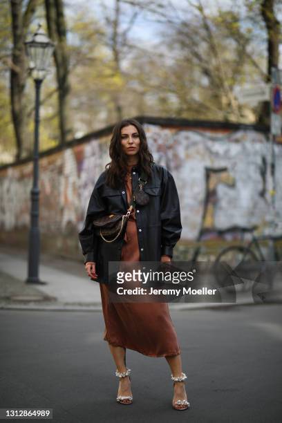 Masha Sedgwick wearing Jimmy Choo pearl heels, Louis Vuitton Multi Pochette bag, Envelope 1976 midi dress and black Gestuz jacket on April 11, 2021...