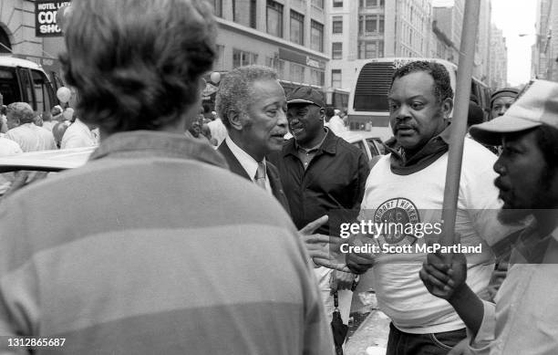 During his campaign for Manhattan Borough President, New York City Clerk David Dinkins shakes hands with a union member from the Communications...