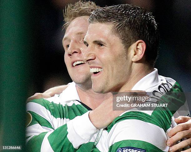 Celtic's Gary Hooper celebrates with teammate Kris Commons after scoring the 3rd goal against Rennes during a UEFA Europa League group I football...