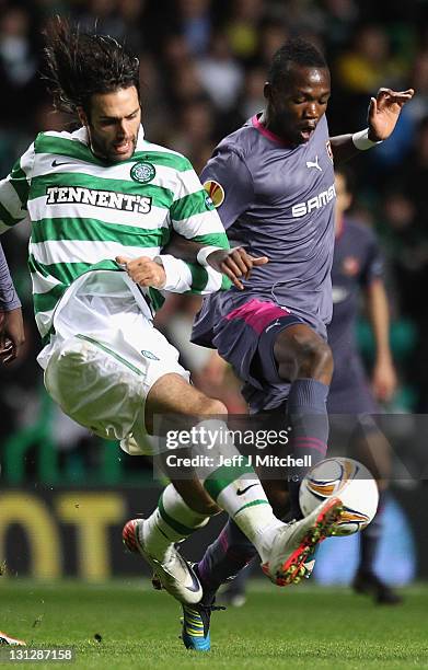 Giorgos Samaras of Celtic tackles Romain Danze of Stade Rennais during the UEFA Europa League group I match between Celtic and Stade Rennais at...