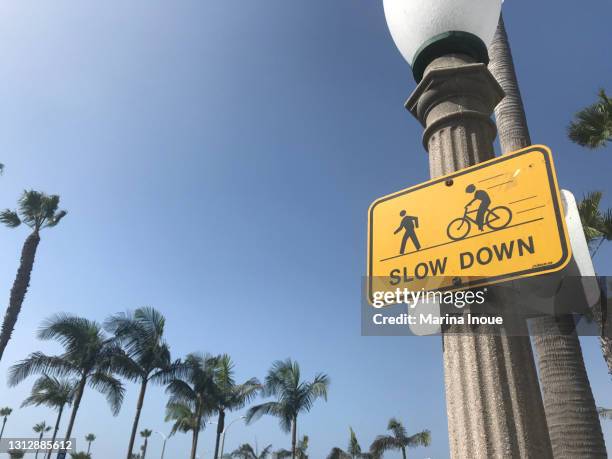 sign along the beach walk - slow stock pictures, royalty-free photos & images