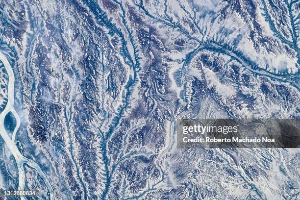 winter scenes seen from space, the iss flies over quebec province in canada - ice pattern stock pictures, royalty-free photos & images