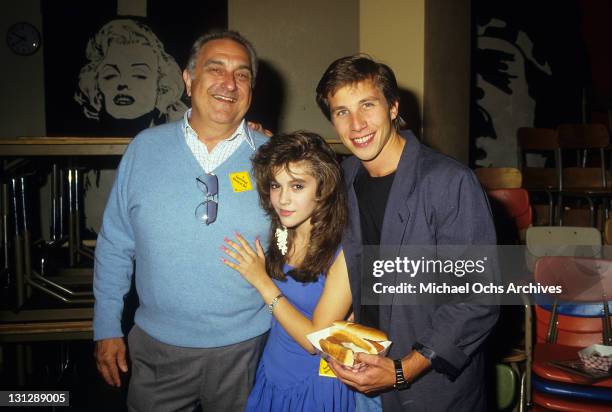 Unidentified man hugged by Alyssa Milano and Rob Stone from the television movie 'Crash Course', 1988.