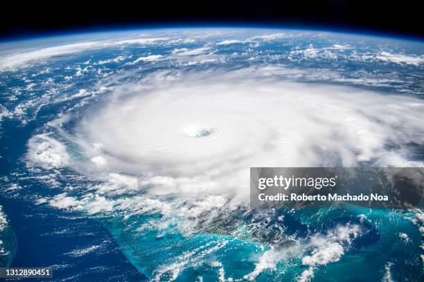 satellite view of hurricane dorian, year 2019 - burrasca fotografías e imágenes de stock