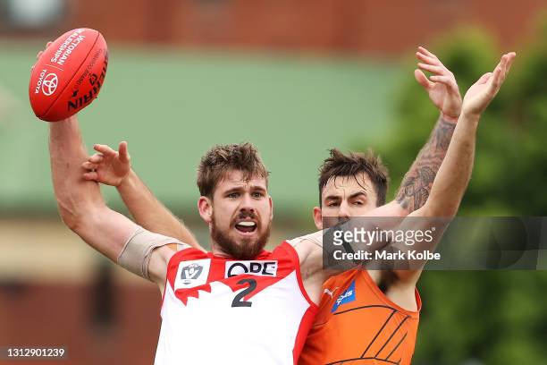 Kaiden Brand of the Swans appeals to the umpire under pressure from Zach Sproule of the Giants during the round one VFL match between the Sydney...