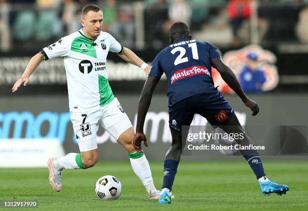 Besart Berisha of Western United is pressured by Ruon Tongyik of the Mariners during the A-League match between Western United FC and the Central...