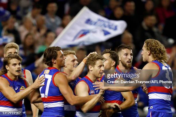 Lachie Hunter of the Bulldogs celebrates a goal during the round five AFL match between the Western Bulldogs and the Gold Coast Suns at Marvel...