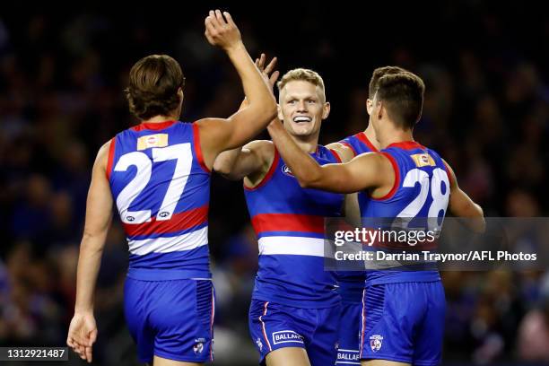 Adam Treloar of the Bulldogs is celebrates a goal during the round five AFL match between the Western Bulldogs and the Gold Coast Suns at Marvel...