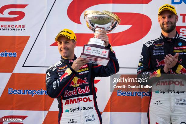 Jamie Whincup drives the Red Bull Ampol Racing Holden Commodore ZB celebrates on the podium during race 1 of the Tasmania SuperSprint which is part...