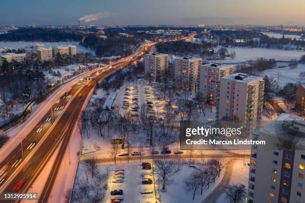 aerial view of highway e18 and apartment buildings - stockholm winter stock pictures, royalty-free photos & images